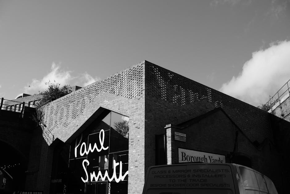 A large pile of mixed scrap metal, including rusted steel rods, twisted wires, and various small metallic objects, occupies the central area of the image. The metals exhibit weathered, rusty, and corr